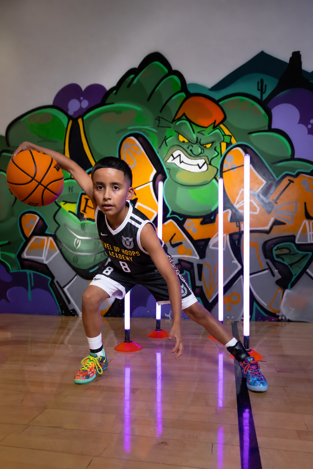 A Level Up athlete working with a basketball in the gym